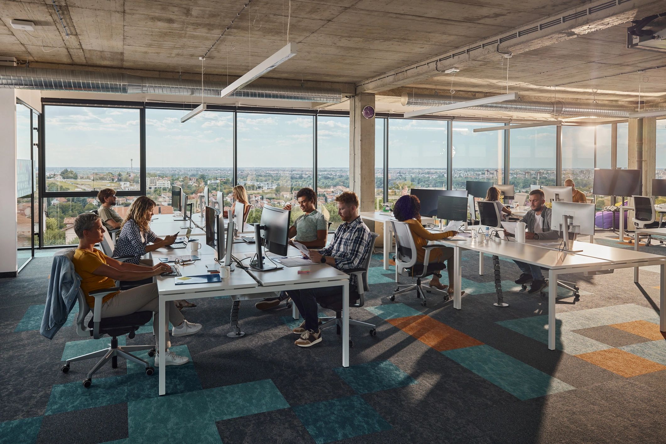 Technology support team collaborating in a modern office