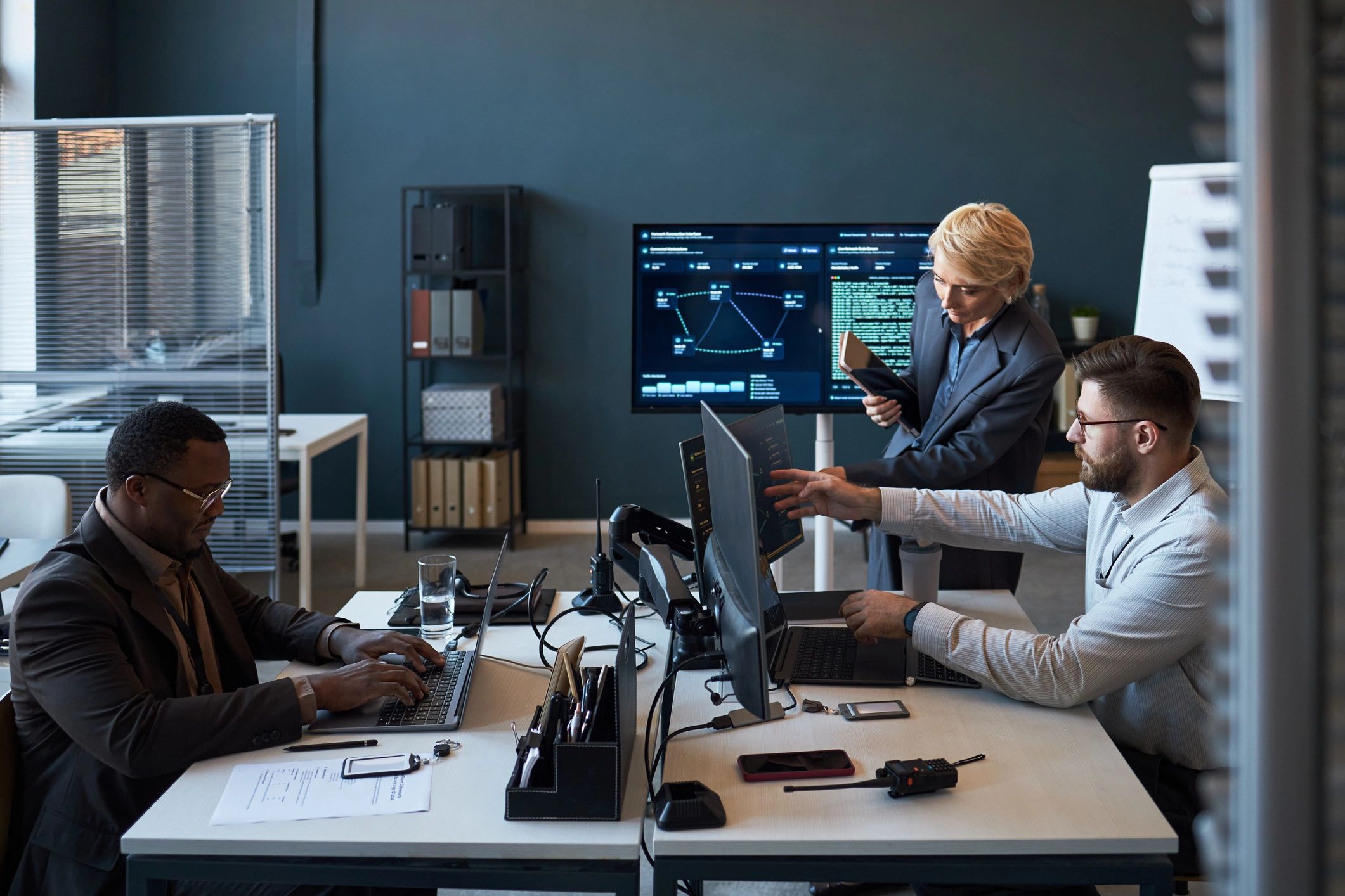 Network engineers reviewing dashboards in an office